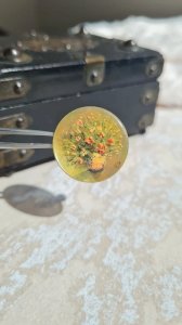 Antique brooch, painted on mother-of-pearl, signed YS.