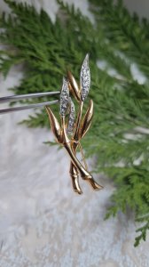 Golden bamboo brooch with rhinestones and gold plating