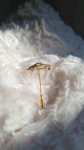 Brooch - gold-plated pin with sapphire