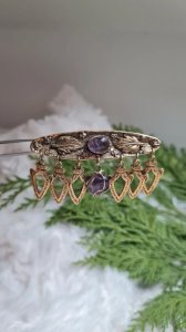 Vintage gold brooch with amethysts.