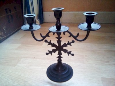 Three-branch black metal candelabrum in gothic style