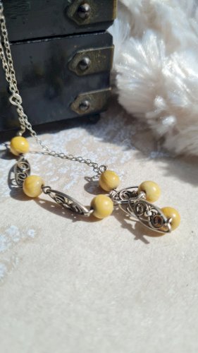 collier ancien filigrane en argent et matière noble