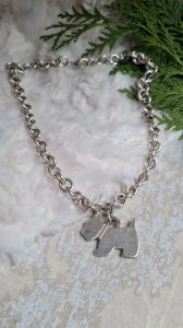 Necklace with a silver-plated dog.