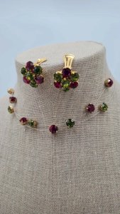 Necklace and earrings signed Dominique. A - red and green rhinestones.