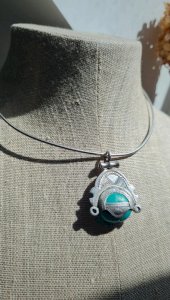 Tuareg necklace, prestigious traditional jewelry in silver with a turquoise stone.
