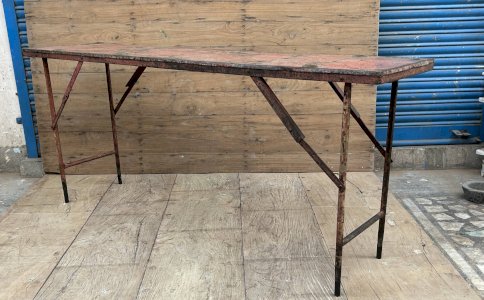 Folding metal workshop console with original patina.