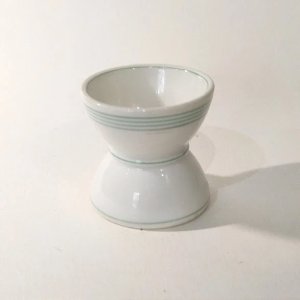 Vintage white porcelain double egg cup (or diabolo egg cup) with green stripes.