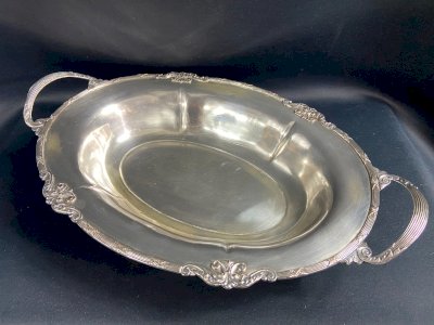 Flat hollow oblong bread basket with silver-plated metal handles in Louis XVI style.