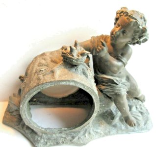 19th century pendulum body in sculpted spelter featuring a cherub near a bird's nest.