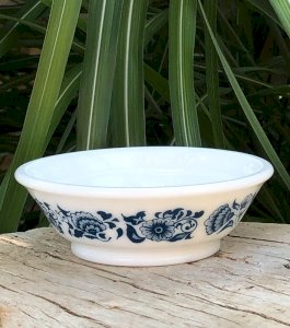 Vintage Avon opaline bowl with blue floral patterns.