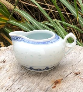 White and blue porcelain creamer