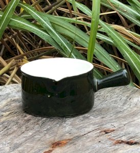 Vintage dark green ceramic creamer