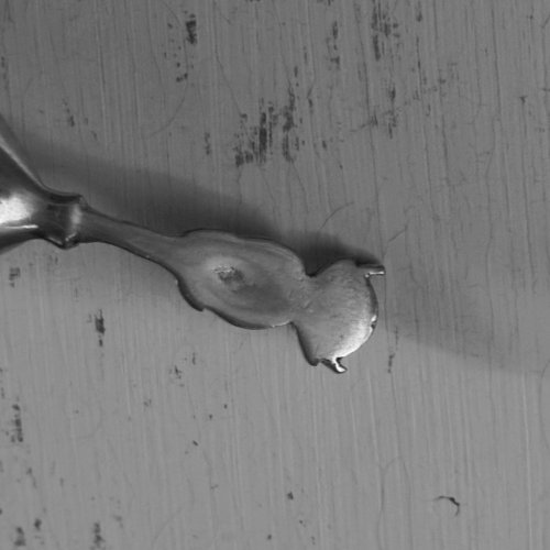 Cuillère en argent ornementée d'un démon M3627