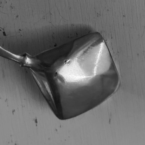Cuillère en argent ornementée d'un démon M3627