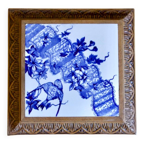 Dessous de plat en terre de fer Longwy décor à loiseau, XIXe siècle