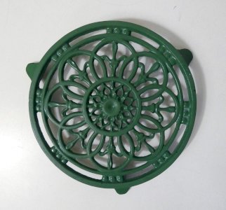 vintage green cast iron trivet
