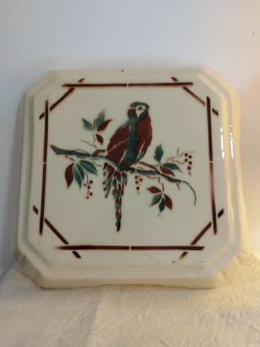 Dessous de plat vintage en céramique, motif perroquet