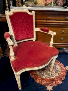 Red velvet cabriolet armchair, 18th century Louis XVI style.