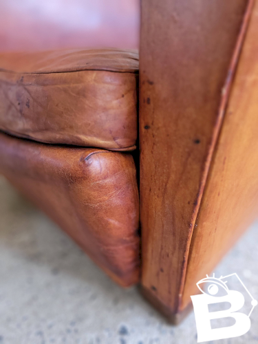 Fauteuil club en cuir patiné