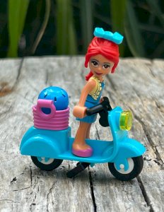Lego Friends figure and scooter
