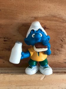 Smurf figurine having a snack.