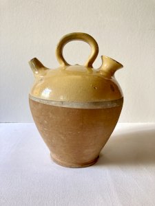 Glazed yellow terracotta jug