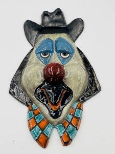 Large wall-mounted clown mask in glazed terracotta