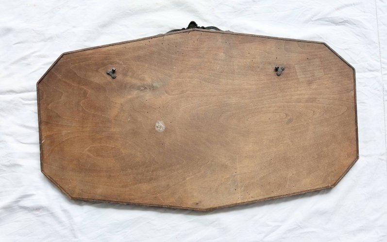 Grand miroir ancien biseauté – bois foncé et nœud décoratif en métal bronzé