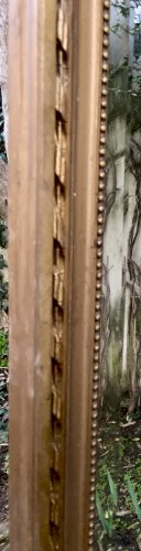 Grand Miroir ancien fin XIXe - glace biseauté bordé par un range de perles 