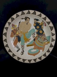 Large thick earthenware dish with a warrior scene decoration China 1920-1930