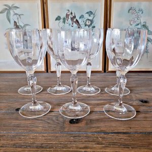 Large crystal wine or water glasses, vertical stripes and decorated stem.