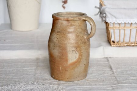 Antique rustic stoneware jar with handle
