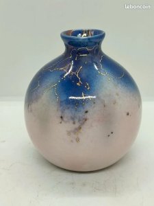 Pretty little antique blue and white vase with gilded inlays bearing a mark.