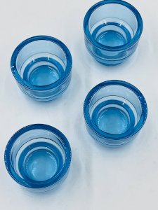 Set of 4 aquamarine glass candle holders from Ikea.
