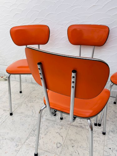 Lot de 4 chaises en skaï orange