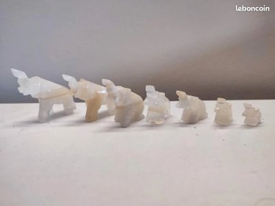 Set of 7 small stone elephants in good condition