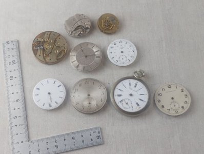 Set of 9 vintage movements/mechanisms + pocket watch dials