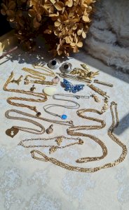 Collection of antique and vintage costume jewelry and gold-plated pieces.