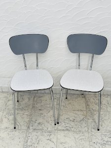 Set of two vintage gray formica and chrome chairs.