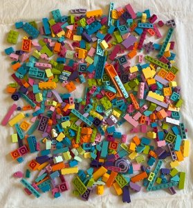 Lot/bulk of 700 pieces of Lego Friends in flashy and vibrant colors.