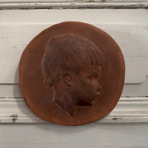 Terracotta medallion by Charles Filleul profile of a young child 20th century M3544