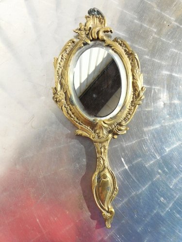 MIROIR A MAIN EN BRONZE AVEC GLACE BIZEAUTEE