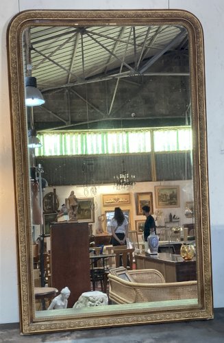 Miroir de cheminée - bois vernis  et stuc doré à. décor de palmettes 