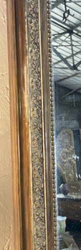 Miroir de cheminée - bois vernis  et stuc doré à. décor de palmettes 