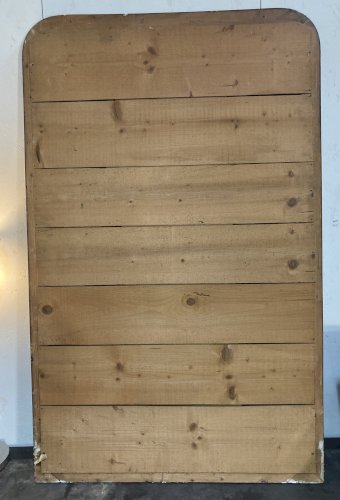 Miroir de cheminée - bois vernis  et stuc doré à. décor de palmettes 