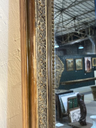 Miroir de cheminée - bois vernis  et stuc doré à. décor de palmettes 