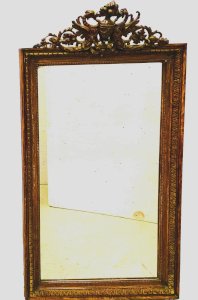 Miroir de style Napoléon III en bois et stuc patiné XX siècle