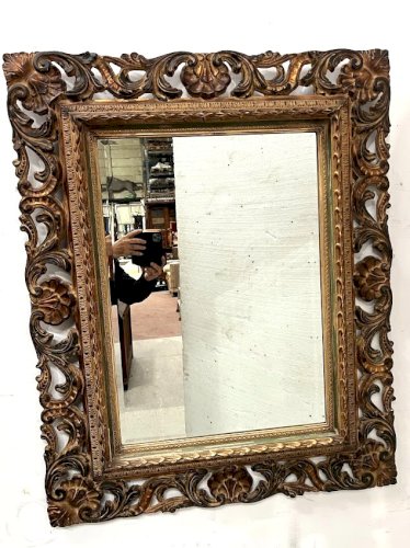 Miroir de style Napoléon III en bois sculpté XX siècle