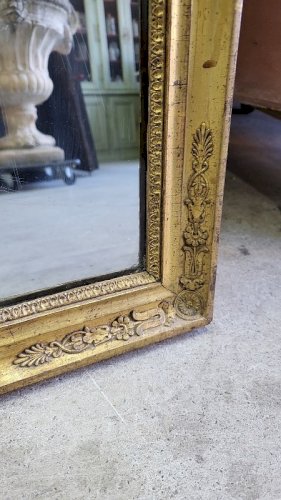 MIROIR EN BOIS DORE A PALMETTES DU XIX ème SIECLE