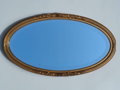Oval gilded wooden mirror, Louis XVI style